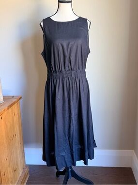 Classic Black Sleeveless Women’s Dress with opening in lower back.